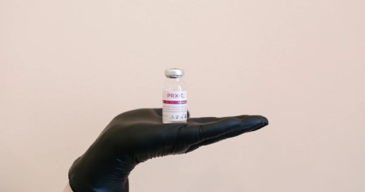 Aesthetic practitioner holds skin rejuvenation solution for PRX treatments in St. Charles, IL
